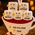 Load image into Gallery viewer, Decorative ornament shaped like a mug with marshmallows named Kevin, Jeffrey, Nicole, Chris, Adam, and 'The Williams Year' on a blurred background.
