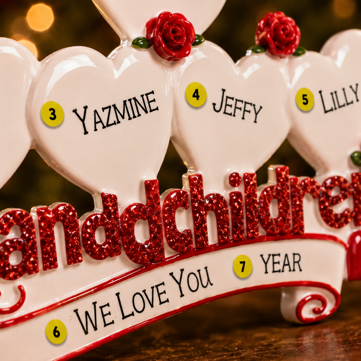 Decorative ornament with hearts and names on a wooden surface
