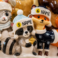 Load image into Gallery viewer, Decorative figurines of animals wearing winter hats with numbers and 'NAME' text.

