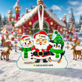 Load image into Gallery viewer, Christmas ornament with Santa, snowman, and penguin against a snowy village background
