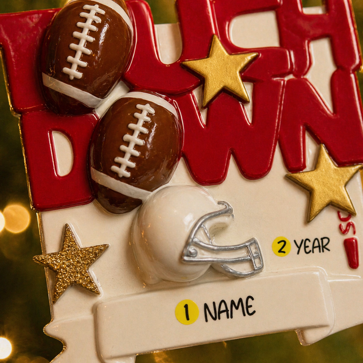 Decorative ornament with footballs, helmet, and stars on a red background
