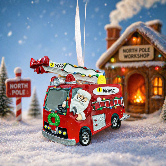 Decorative Christmas ornament of a red fire truck with Santa Claus, set against a snowy scene with a North Pole workshop.