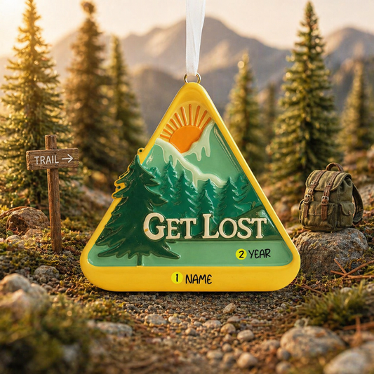 Decorative ornament with 'Get Lost' text in a forest setting