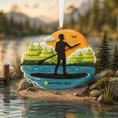 Load image into Gallery viewer, Decorative ornament with a silhouette of a person paddleboarding, set against a scenic lake background.
