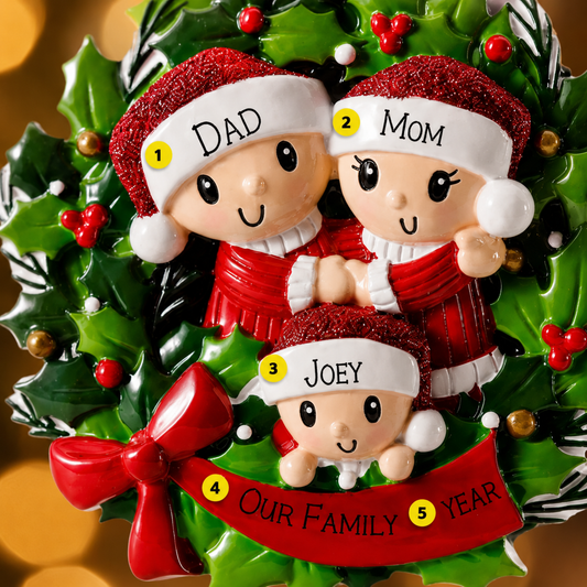 Christmas ornament with family of 3 design on a blurred Christmas tree background