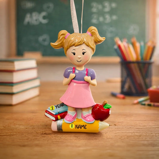 Decorative ornament of a girl with pigtails on a desk with educational items in the background