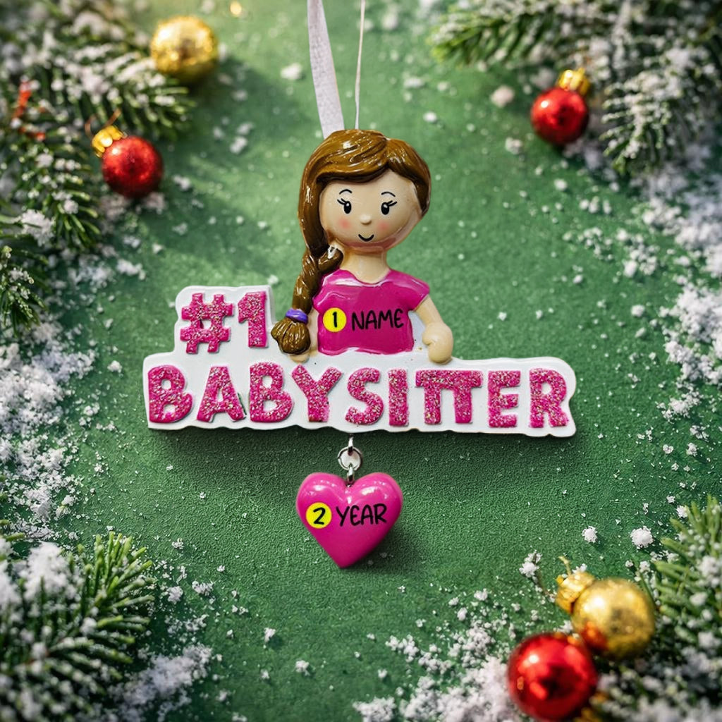 Personalized Babysitter Christmas ornament featuring a detailed raised 3D front design with glitter pink lettering and a charming girl figure. Custom name is added on the shirt and year is written on the hanging heart charm. Bright pink and white holiday colors stand out beautifully on the tree. Flat 2D back for easy hanging. Perfect keepsake gift for babysitter appreciation, nanny thank you present, childcare provider Christmas decor.
