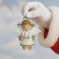 Load image into Gallery viewer, Angel ornament held by a gloved hand against a light blue background
