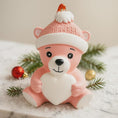 Load image into Gallery viewer, Personalized Pink Teddy Bear Christmas Ornament featuring a sweet baby bear wearing a cozy winter hat and holding a heart that can be customized with a name and year or Baby’s 1st Christmas. This adorable baby girl ornament is designed in soft pink tones, perfect for celebrating a newborn’s first holiday season. A heartwarming keepsake gift for new parents, baby showers, or a special Christmas memory that will be treasured for years to come.
