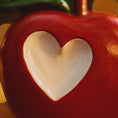 Load image into Gallery viewer, Red ceramic apple with a heart-shaped center on a blurred background
