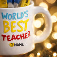 Load image into Gallery viewer, Personalized teacher ornament designed as a white mug filled with classroom tools including scissors ruler pencil and marker. The front reads Worlds Best Teacher with custom name personalization. Mostly 2D design with raised 3D tool details. A perfect Christmas ornament gift for teachers educators and school staff.
