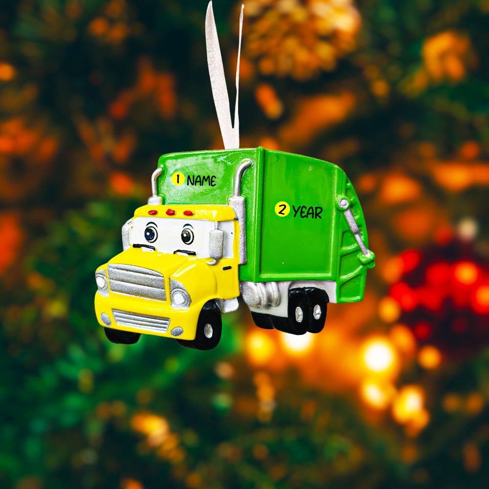 Cute personalized garbage truck ornament in green and yellow with animated truck face. Custom name and year option for kids who love trucks, garbage trucks, city vehicles and recycling themes. Perfect holiday tree decor for boys and toddlers obsessed with trucks. Bright colors, fun design, and adorable Christmas keepsake.