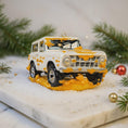Load image into Gallery viewer, Decorative ornament of a vintage SUV on a snowy surface with Christmas decorations.
