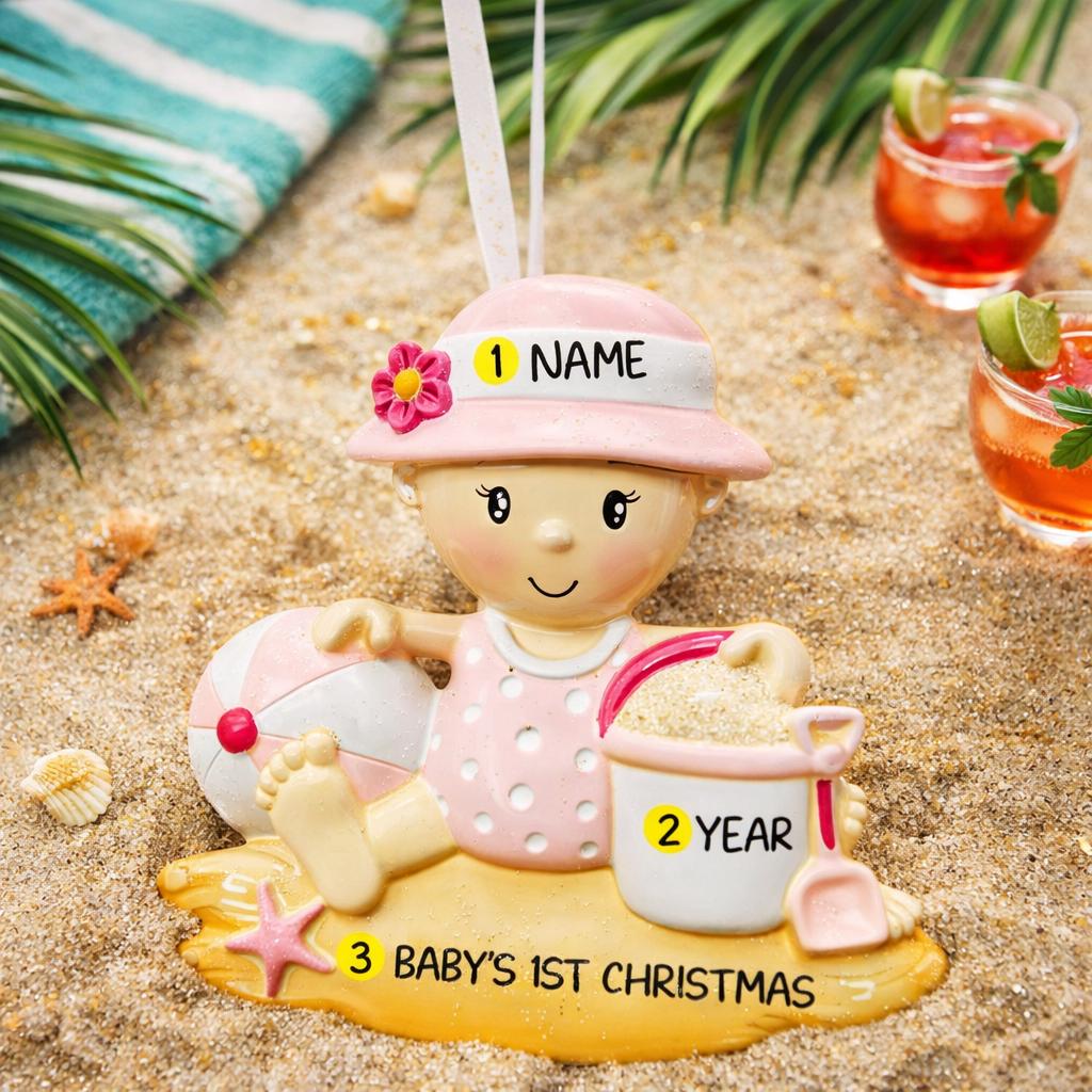 Personalized baby first Christmas ornament for baby girl featuring a beach and summer inspired design. This adorable keepsake includes handwritten name and year personalization, a soft pink baby figure, sand details and playful seaside elements. The ornament has a lightweight 2D base with raised 3D detailing on the front only. Perfect for baby’s first Christmas, nursery decor, coastal holiday themes and meaningful family gifts.