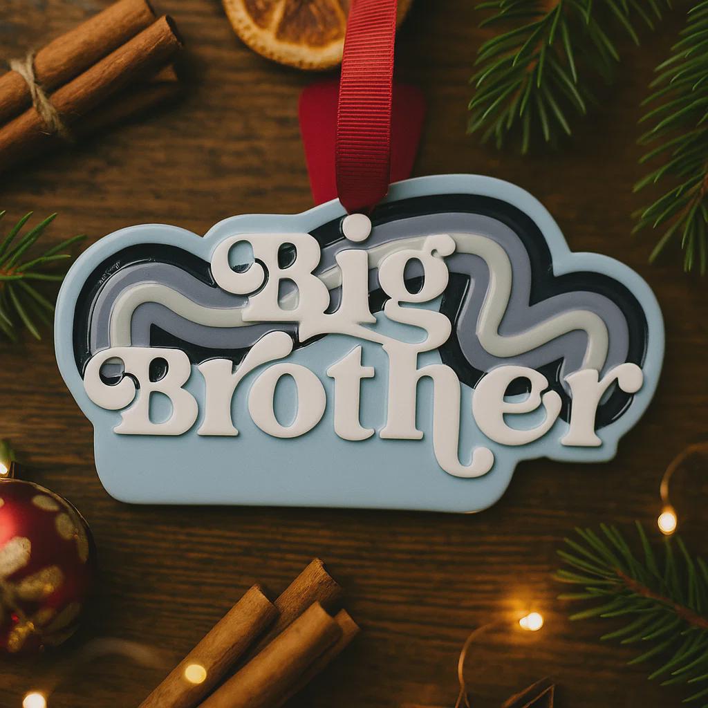 Personalized Big Brother Christmas ornament with custom name and year detail in layered blue and white design. This sibling holiday ornament features raised 3D front lettering and a lightweight flat back, perfect for Christmas tree decor. 