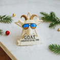 Load image into Gallery viewer, Decorative figurine of a goat wearing sunglasses with 'G.O.
