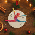 Load image into Gallery viewer, Colorful gymnast ornament on a wooden surface with Christmas decorations
