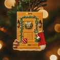 Load image into Gallery viewer, Decorative Christmas ornament shaped like a wooden door with festive decorations on a blurred Christmas tree background.
