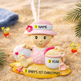 Load image into Gallery viewer, Personalized baby first Christmas ornament for baby girl featuring a beach and summer inspired design. This adorable keepsake includes handwritten name and year personalization, a soft pink baby figure, sand details and playful seaside elements. The ornament has a lightweight 2D base with raised 3D detailing on the front only. Perfect for baby’s first Christmas, nursery decor, coastal holiday themes and meaningful family gifts.
