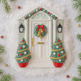 Load image into Gallery viewer, Decorative Christmas scene with a door, wreath, and Christmas trees on a snowy background.
