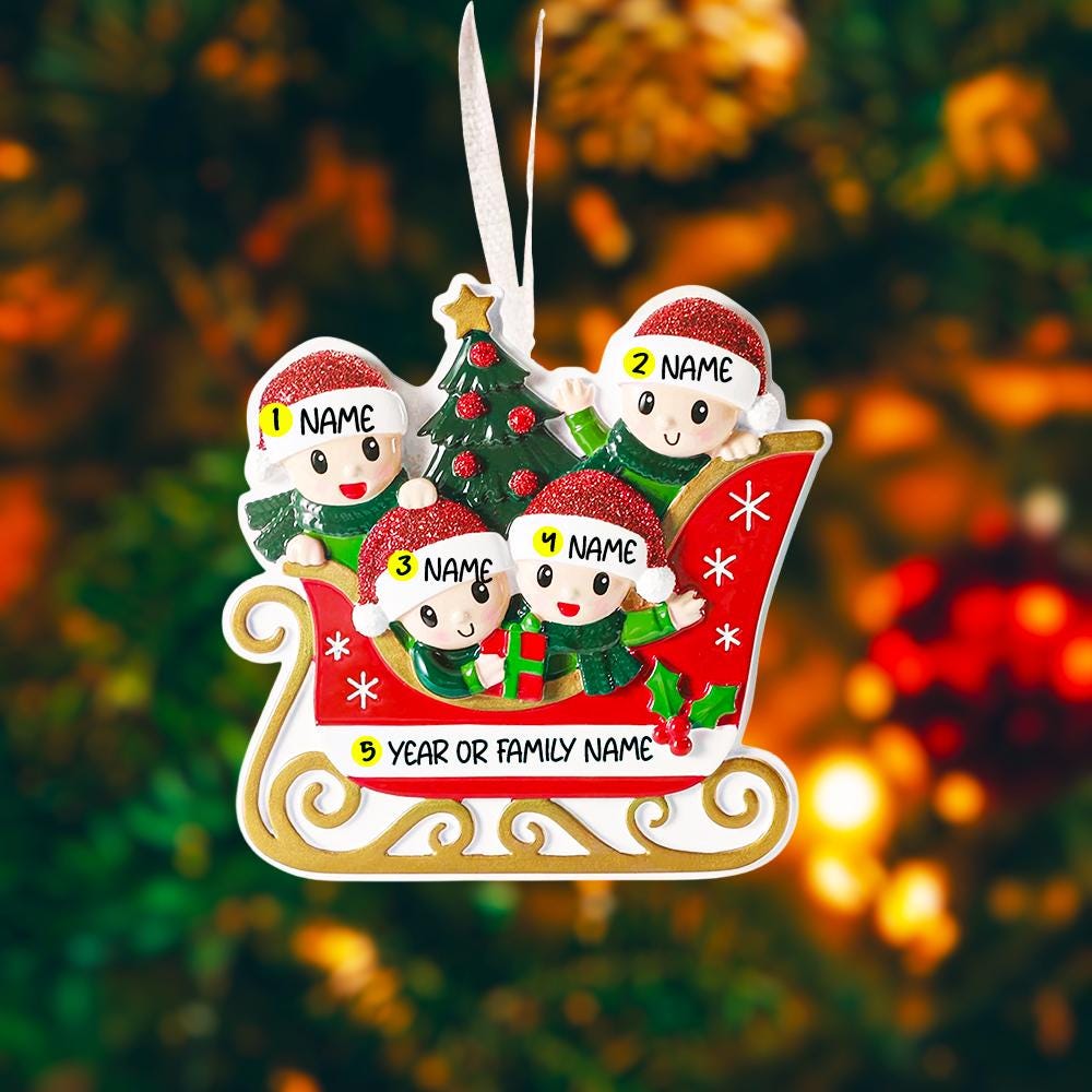 Personalized Christmas ornament with four elves on a sleigh in front of a Christmas tree.