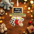 Load image into Gallery viewer, Decorative sign with stockings and text on a wooden surface with Christmas decorations.

