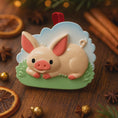 Load image into Gallery viewer, Decorative pig ornament on a wooden surface with spices and oranges.
