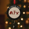 Load image into Gallery viewer, Personalized weightlifting and fitness Christmas ornament featuring a raised 3D front with bold circular design and red strength icons including boxing, gymnastics rings, and weightlifting. The ornament has a textured black outer rim and a flat 2D back for easy hanging. Includes a hanging kettlebell charm for added depth and movement. Hand-added personalization allows a name and year or family name. Photographed on a festive Christmas tree background with warm holiday lights.

