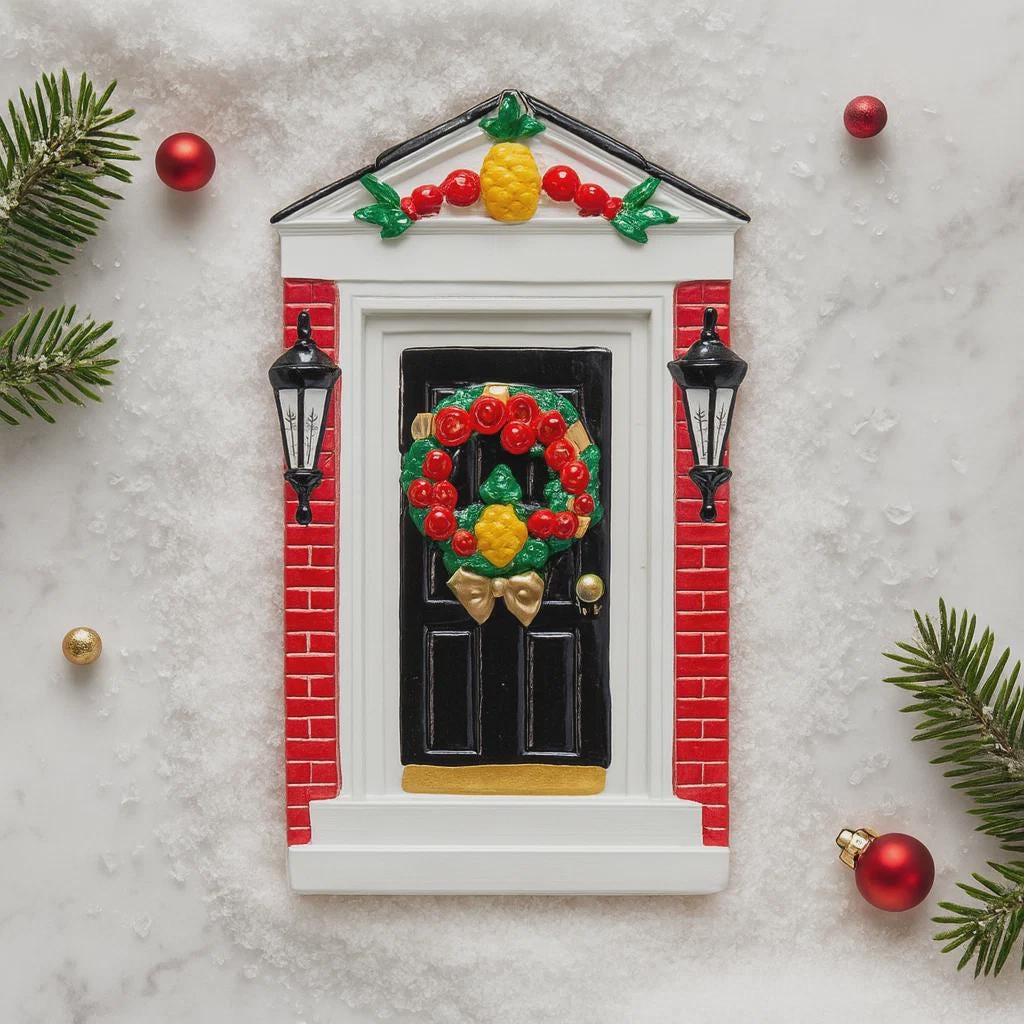Decorative door with wreath and ornaments on a textured surface
