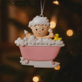 Load image into Gallery viewer, Decorative ornament of a baby lamb in a bathtub with a yellow duck, hanging on a tree.
