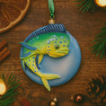 Load image into Gallery viewer, Decorative fish ornament on a wooden surface with Christmas decorations.
