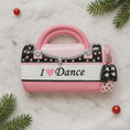 Load image into Gallery viewer, Pink and black polka dot handbag-shaped container with 'I ❤️ Dance' text on a marble surface with Christmas decorations.

