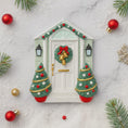Load image into Gallery viewer, Decorative Christmas door ornament with wreath and trees on a marble surface.
