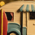 Load image into Gallery viewer, Close-up of a vintage-style toy camper with a striped awning.
