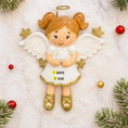 Load image into Gallery viewer, Decorative angel ornament with customizable text on a snowy background
