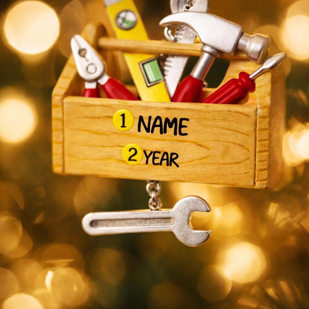 Personalized handyman ornament featuring a wooden style toolbox filled with tools including hammer wrench pliers and level. Custom name and year displayed on the front. Mostly 2D design with raised 3D tool details on the surface. Perfect Christmas ornament for handyman contractors mechanics and skilled trade workers.