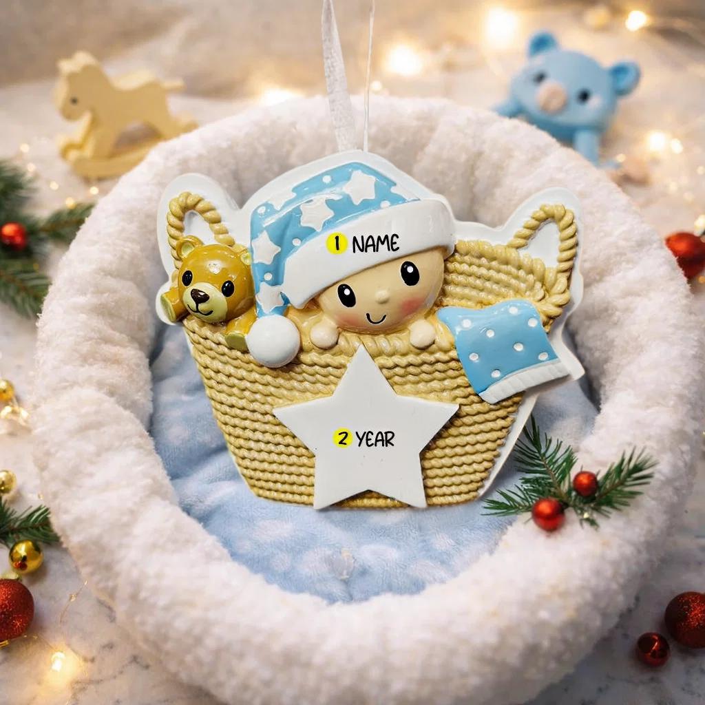Personalized Baby First Christmas Ornament featuring a sweet newborn tucked inside a cozy woven basket with a soft blue star hat and matching blanket. This 3D front design includes raised details, textured knit pattern, and adorable teddy bear accent, creating depth and charm. Name is displayed on the hat and year on the star. A heartfelt keepsake for baby’s first holiday, nursery decor, or newborn gift. Perfect Christmas tree ornament for new parents.