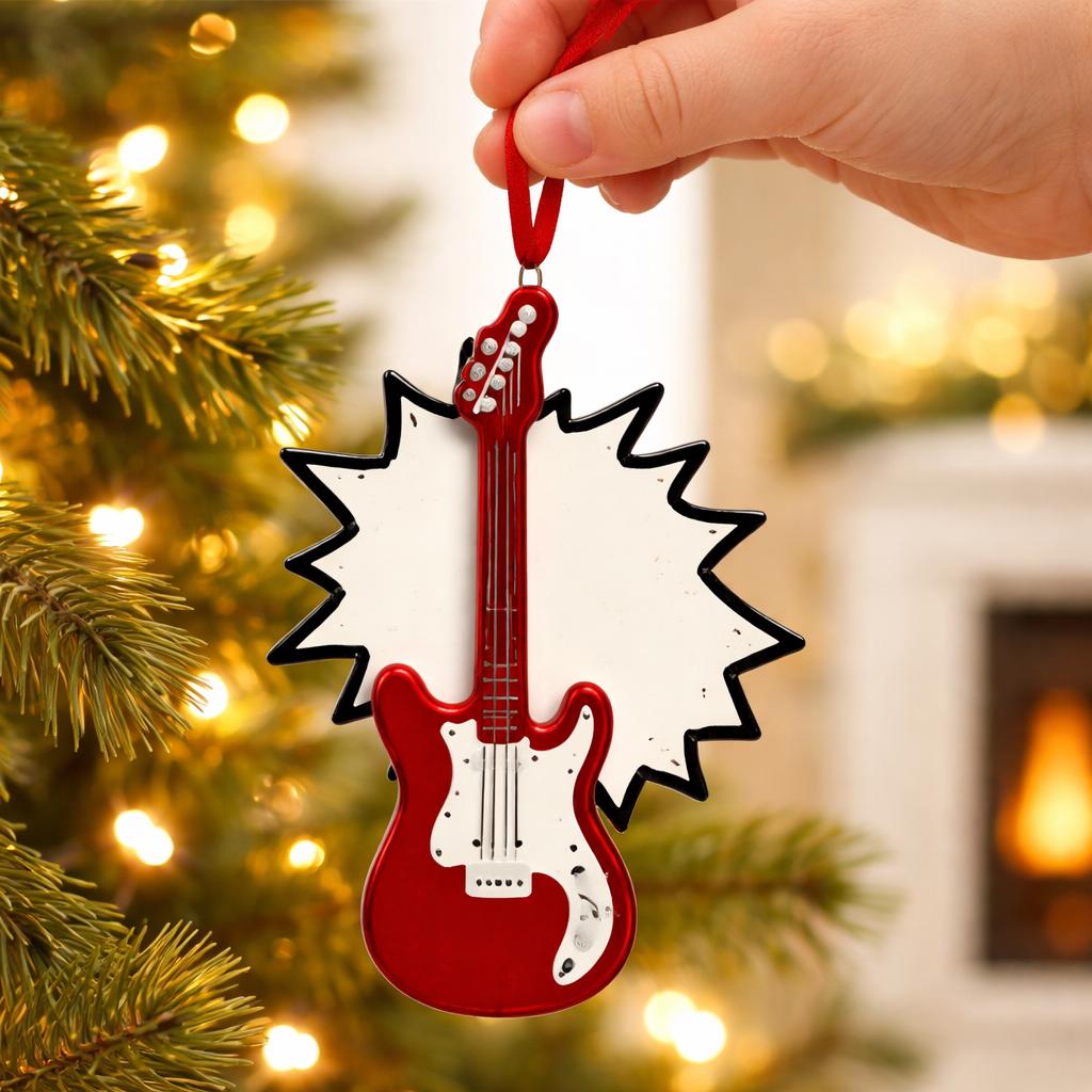 Red guitar-shaped Christmas ornament held by a hand against a festive background with lights and a fireplace.