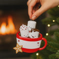 Load image into Gallery viewer, Decorative ornament of a red mug with marshmallows and a gingerbread cookie against a festive background.
