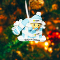Load image into Gallery viewer, Personalized Baby Boy First Christmas Ornament featuring an adorable baby popping out of a blue gift box with a matching hat and pacifier. The name is displayed on the hat while the year is placed on the ribbon detail, with Baby’s 1st Christmas written along the base. Soft blue and white tones, raised 3D elements, and sweet holiday details make this a charming keepsake. Perfect for newborn boys, baby showers, and celebrating a baby’s very first Christmas season.
