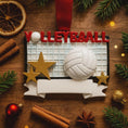 Load image into Gallery viewer, Volleyball-themed ornament on a wooden surface with festive decorations

