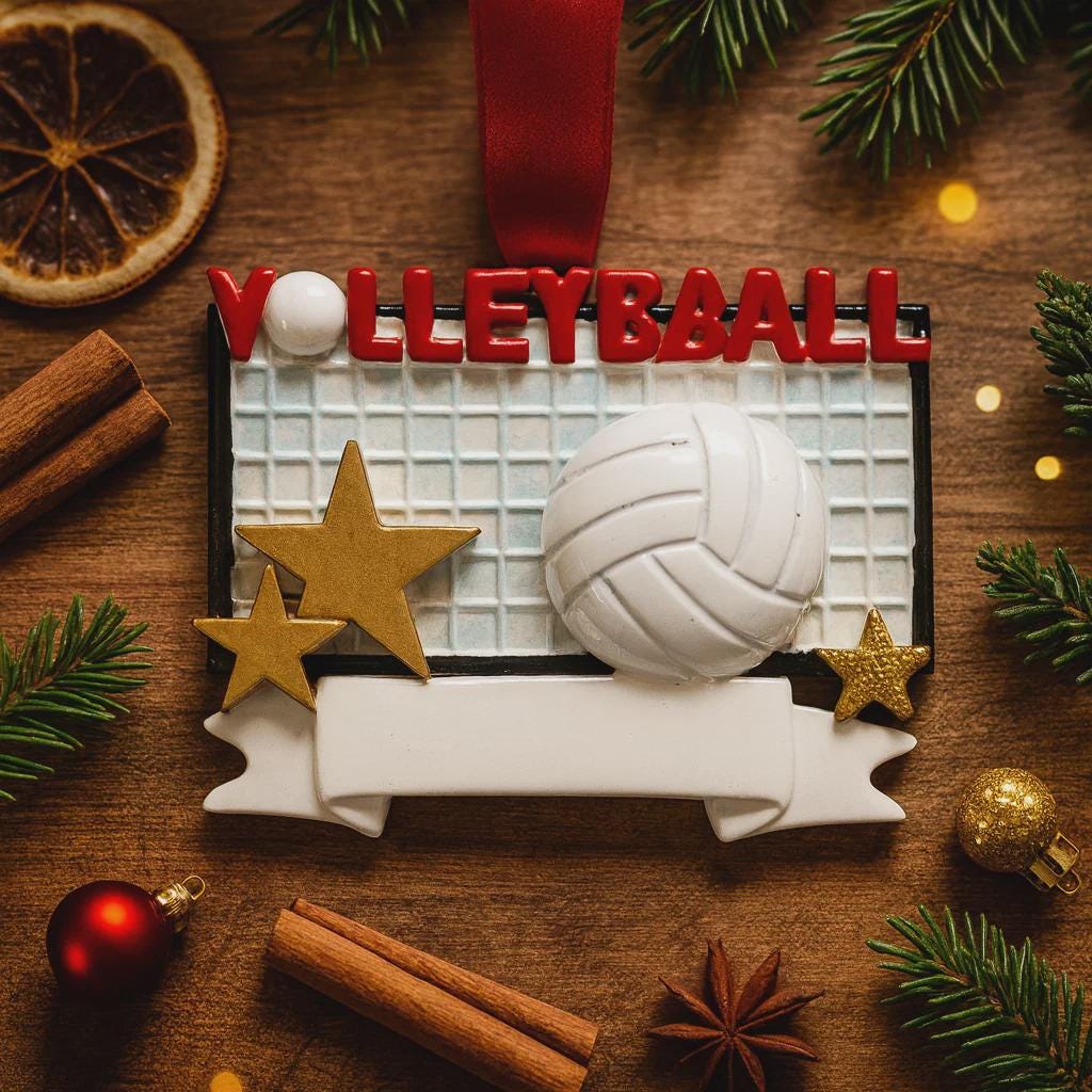 Volleyball-themed ornament on a wooden surface with festive decorations