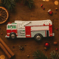 Load image into Gallery viewer, Toy fire truck on a wooden surface with Christmas decorations

