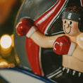Load image into Gallery viewer, Decorative figurine of a boxer with a blurred light in the background
