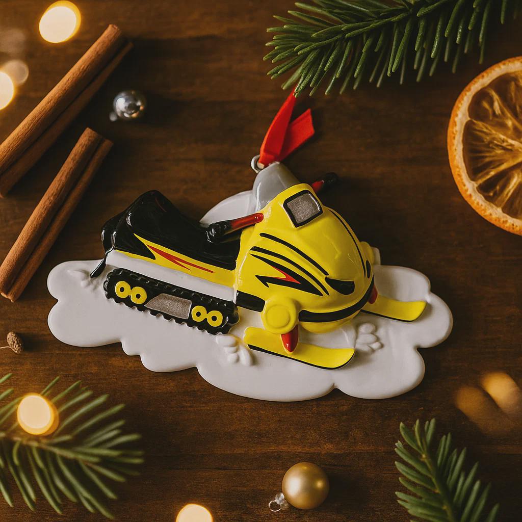 Christmas ornament of a snowmobile on a wooden surface with festive decorations