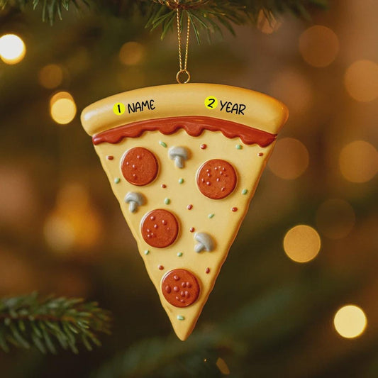 Pizza slice ornament with customizable text on a Christmas tree.