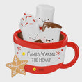 Load image into Gallery viewer, Decorative mug with cartoon marshmallows and a gingerbread man inside, featuring text 'Family Warms the Heart'.
