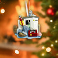 Load image into Gallery viewer, Decorative Christmas ornament with tools and equipment on a blurred Christmas tree background
