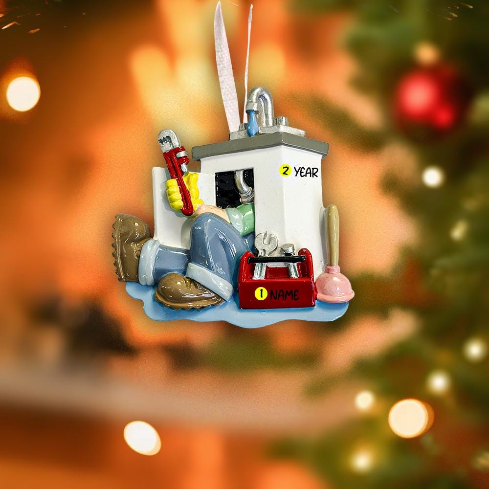Decorative Christmas ornament with tools and equipment on a blurred Christmas tree background