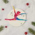 Load image into Gallery viewer, Colorful silhouette of a dancer on a circular white board with Christmas decorations around.
